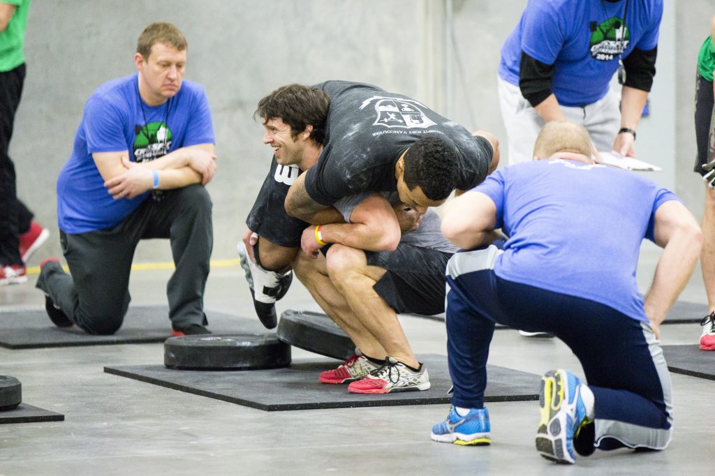  CrossFit ®* Fort Vancouver Invitational 2014, Adam Neiffer doing the buddy squat with Jerome Perryman...and apparently enjoying it